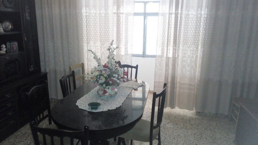 Interior view of a cozy village home dining room in Zujar, Granada.
