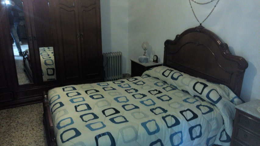 Charming village property in Zujar, Granada, featuring a cozy bedroom with traditional decor and woo.