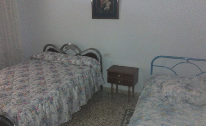 Charming village property in Zujar, Granada, featuring two bedrooms and simple furnishings. Ideal fo.
