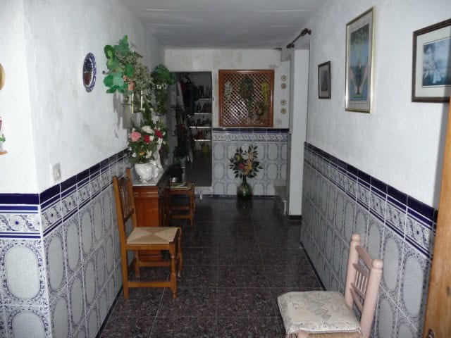 Charming interior of a village property in Zujar, Granada, featuring traditional decor and cozy furn.
