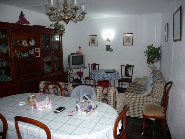 Charming village home interior in Zujar, Granada with traditional furnishings and cozy living space.