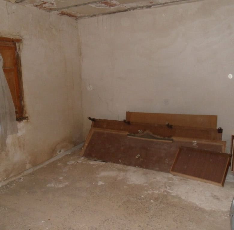 Village property interior with rustic features in Freila, Granada, ideal for renovation.