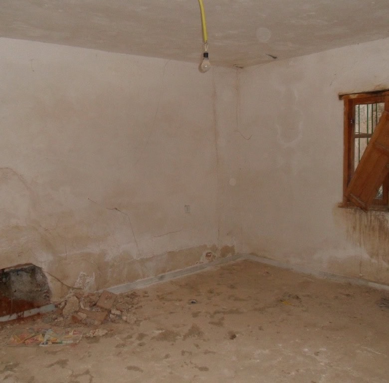 Charming village property in Freila, Granada, with renovation potential and rustic interior features.