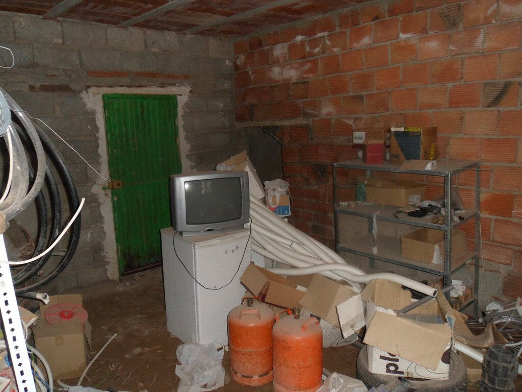 Charming village property in Freila, Granada, with rustic interior, storage area, and traditional br.