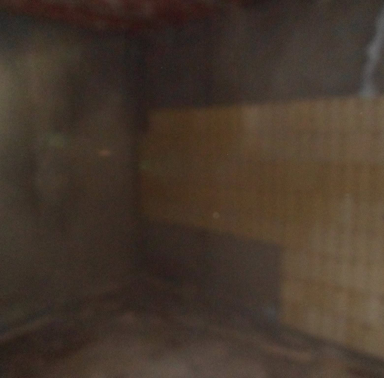 Interior of a village house in Freila, Granada, showcasing traditional brickwork and cozy ambiance.