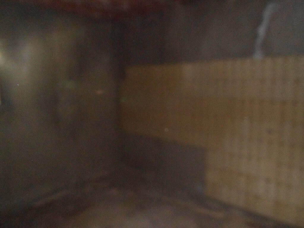 Interior of a village house in Freila, Granada, showcasing traditional brickwork and cozy ambiance.