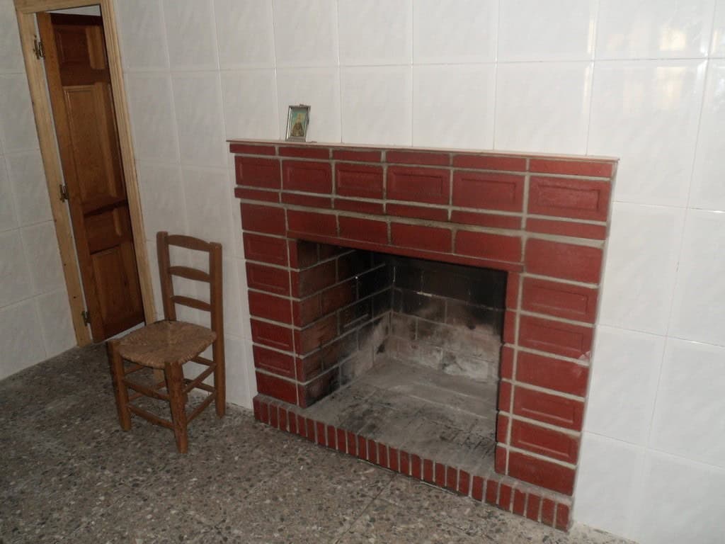 Cave house fireplace in Freila, Granada, Spain. Unique property with rustic charm and traditional fe.