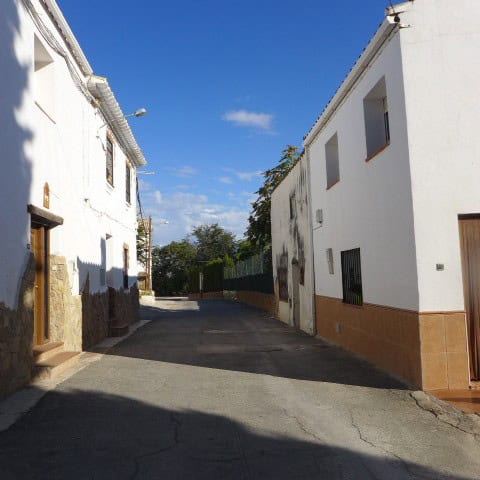 Charming town house in Fontanar, Jaen, with white exterior walls and a quiet street setting.