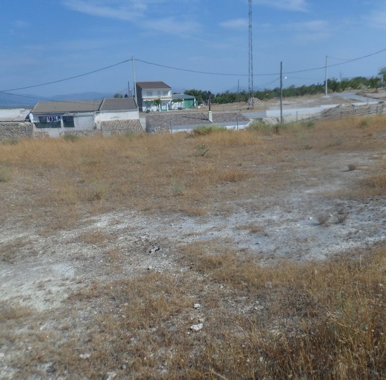 Cave house property in Cuevas del Campo, Granada, with scenic rural surroundings and traditional arc.