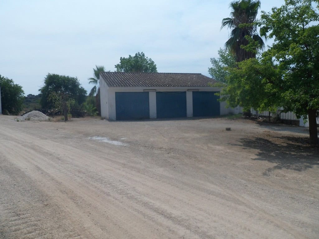 Commercial property in Loja, Granada with spacious outdoor area and surrounding greenery. Commercial property in Loja, Granada with ample outdoor space and scenic surroundings.