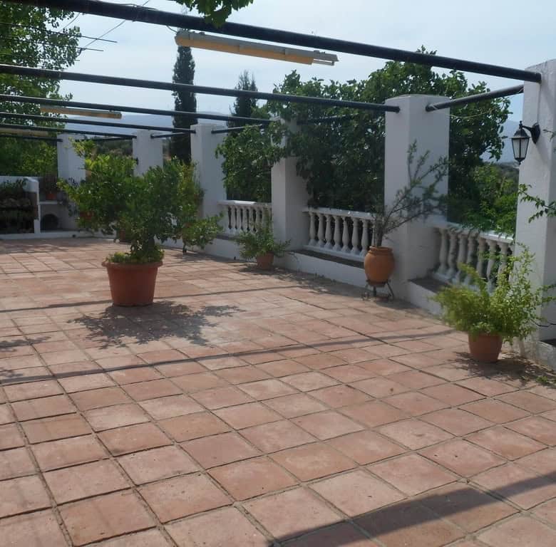 Commercial terrace with potted plants in Loja, Granada, Spain.