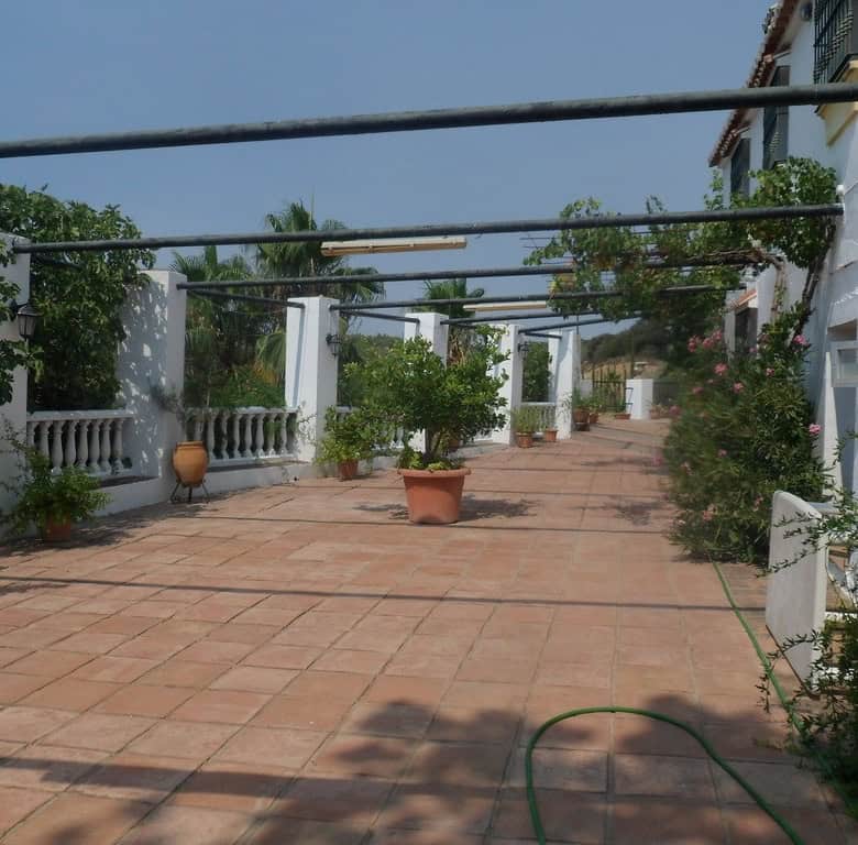 Commercial property in Loja, Granada featuring a large outdoor terrace with plants and scenic surrou.