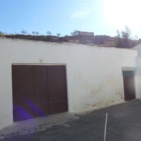 Town house garage in Fontanar, Jaen with secure parking and traditional architecture.