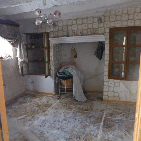 Rural property interior with rustic decor in Don Pedro, Jaen, featuring a cozy living space and trad.