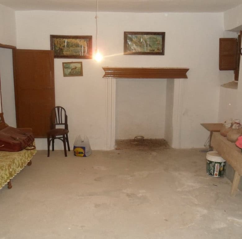 Cave house in Freila, Granada, with rustic interior and traditional decor.