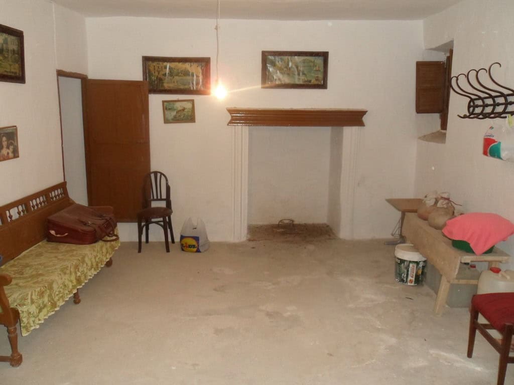 Cave house in Freila, Granada, with rustic interior and traditional decor.
