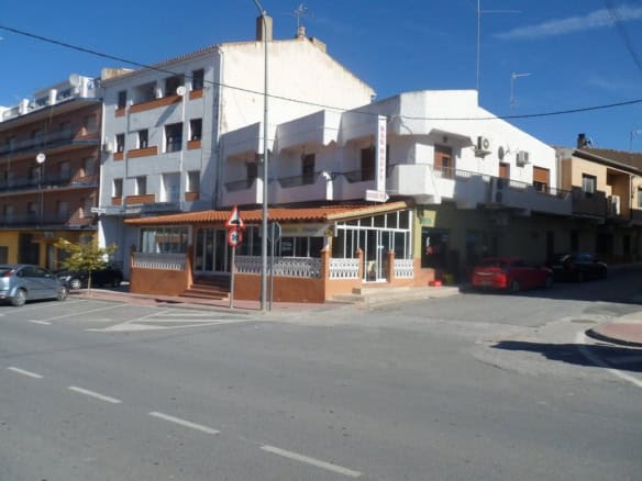 Commercial property for sale in Cuevas del Campo, Granada, featuring a white multi-story building wi.