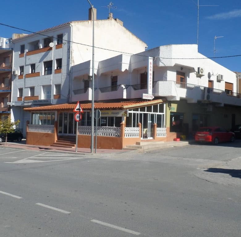 Commercial property for sale in Cuevas del Campo, Granada, featuring a white multi-story building wi.