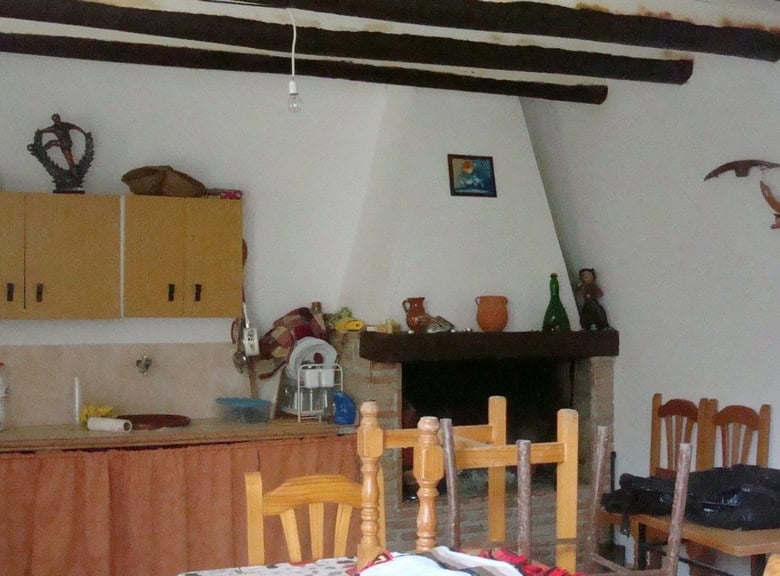 Charming rural property in Hijate, Almeria, featuring traditional decor and rustic wooden beams.