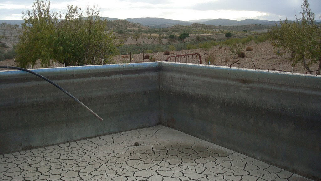View of the rooftop terrace of a rural property in Hijate, Almeria, with scenic landscape background.