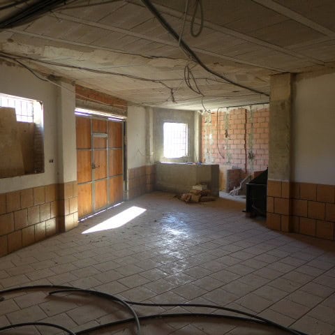 Interior view of a town house in Castril, Granada under renovation. Bright natural light enters thro.