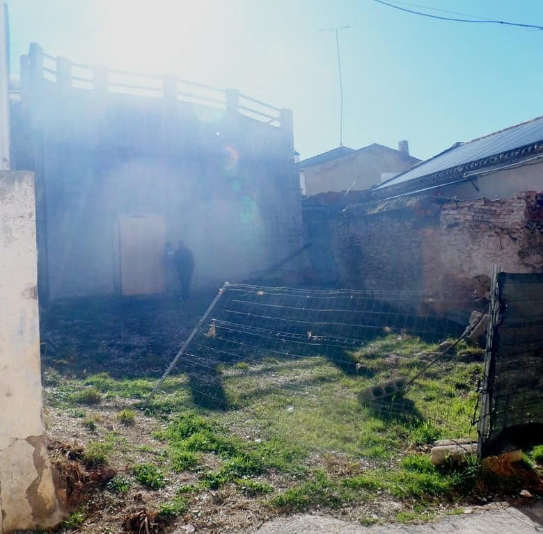 Cave house in Cuevas del Campo, Granada, with rustic exterior and surrounding landscape.