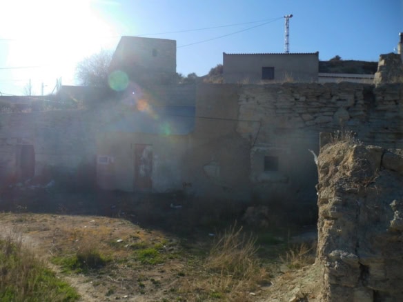 Cave house in Benamaurel, Granada, with traditional stone walls and rustic charm.