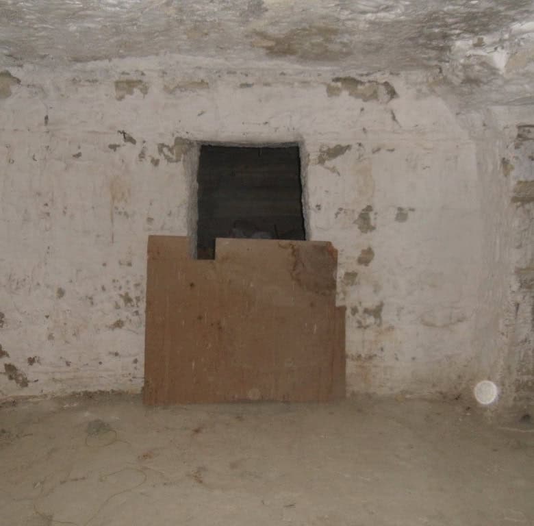 Cave house interior in Benamaurel, Granada, showcasing traditional underground living space.