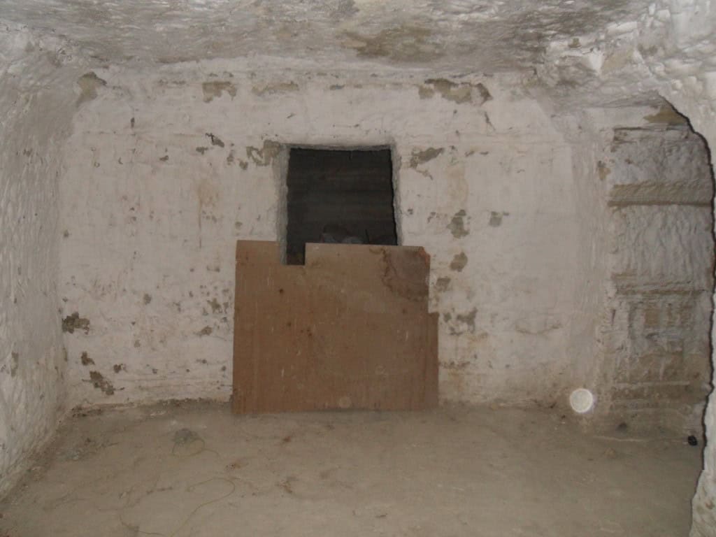 Cave house interior in Benamaurel, Granada, showcasing traditional underground living space.