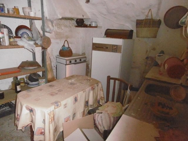 Cozy town house interior with rustic decor in Tijola, Almeria, featuring a small dining area and vin.