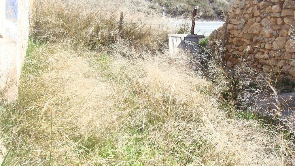 Rural property in Hijate, Almeria with traditional stone walls and natural surroundings.