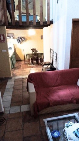 Town House in Quesada, Jaen with cozy living space and rustic decor. Perfect for buyers seeking auth.