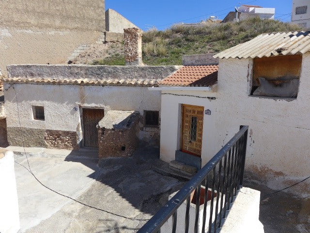 Cave house in Freila, Granada with rustic exterior and traditional architecture.
