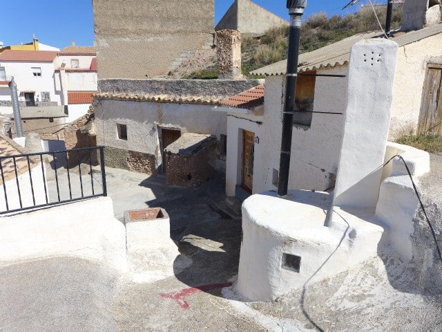 Unique cave house for sale in Freila, Granada, offering rustic charm and scenic mountain views.