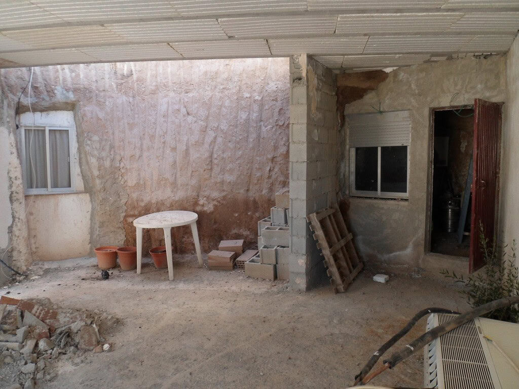 Traditional cave house in Freila, Granada with rustic interior and outdoor space.