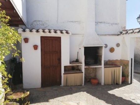 Authentic cave house with outdoor fireplace in Galera, Granada, offering a unique living experience.