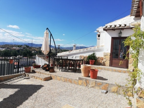 Beautiful terrace of a cave house in Galera with scenic mountain views.