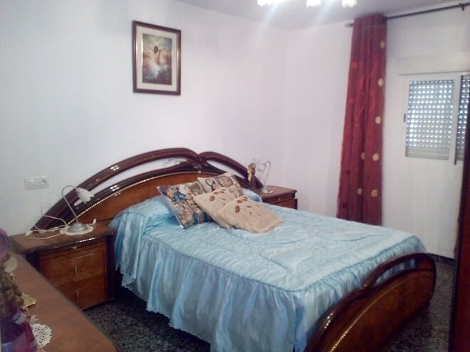 Cozy bedroom in a village property located in Tijola, Almeria, featuring wooden furniture and natura.