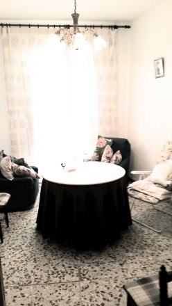 Cozy living room with large window and curtains in Purchena, Almeria village property.