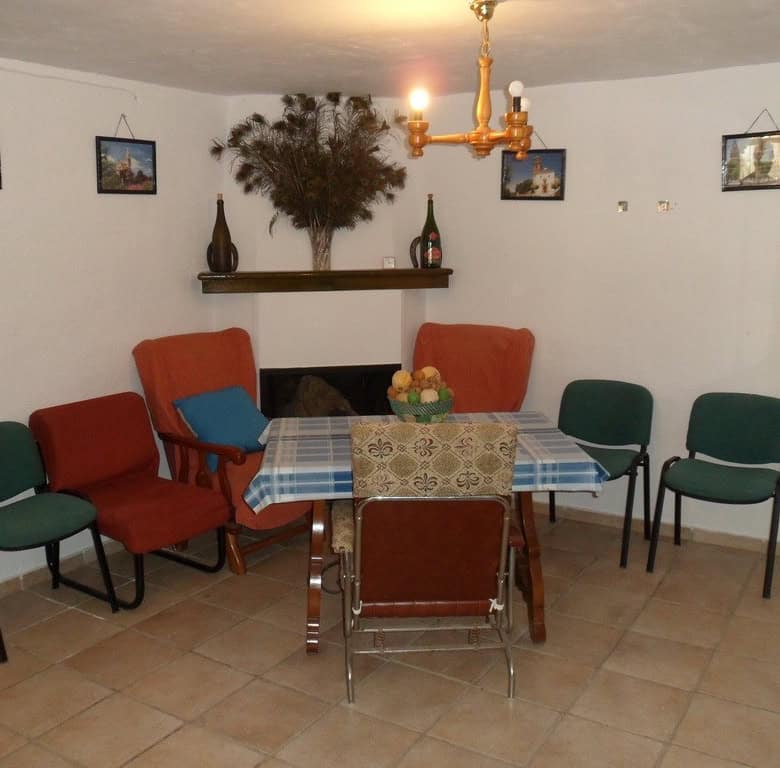 Farm property in Baza, Granada with a cozy dining area and traditional decor. Perfect for rural livi.