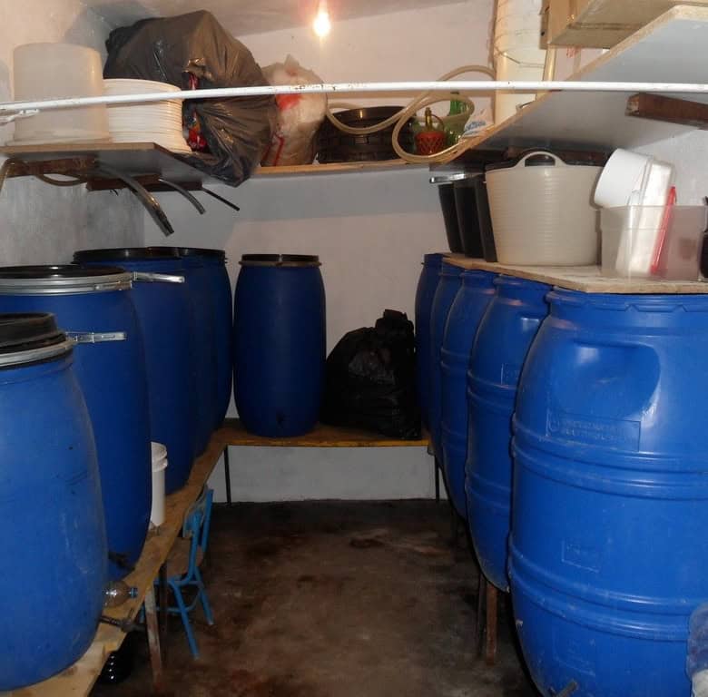 Storage room with blue barrels in a farm property in Baza, Granada.