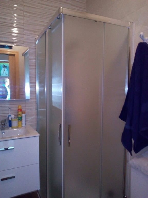 Cozy village home in Cela, Almeria, featuring a compact bathroom with shower enclosure and modern fi.
