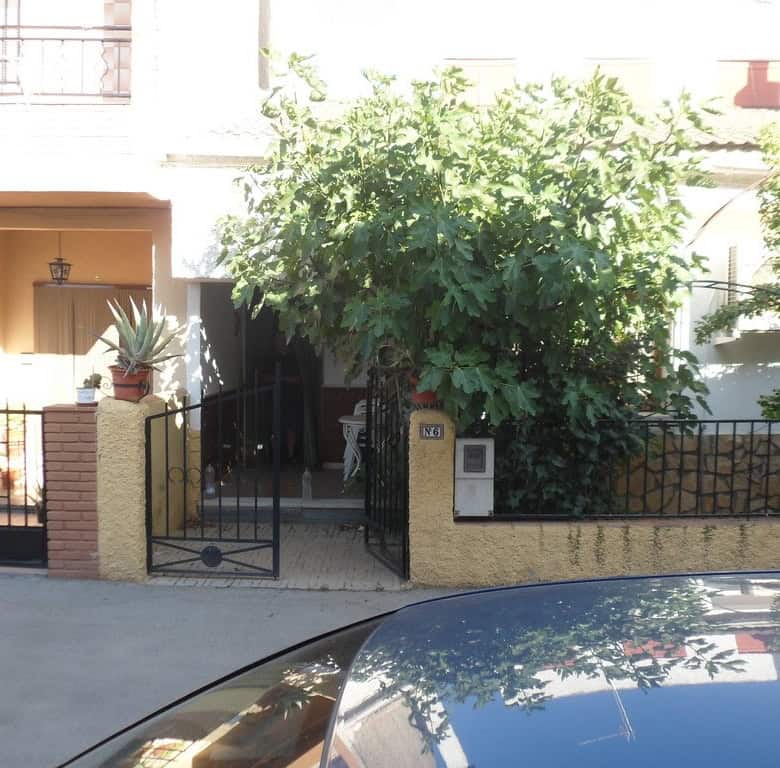 Charming village property in Zujar, Granada, featuring a lush garden and traditional architecture. P.
