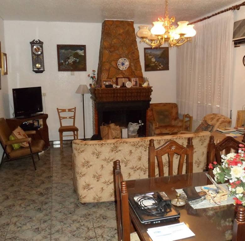 Charming village home in Zujar, Granada, featuring a cozy living room with traditional decor and a f.