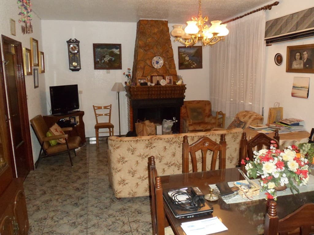 Charming village home in Zujar, Granada, featuring a cozy living room with traditional decor and a f.