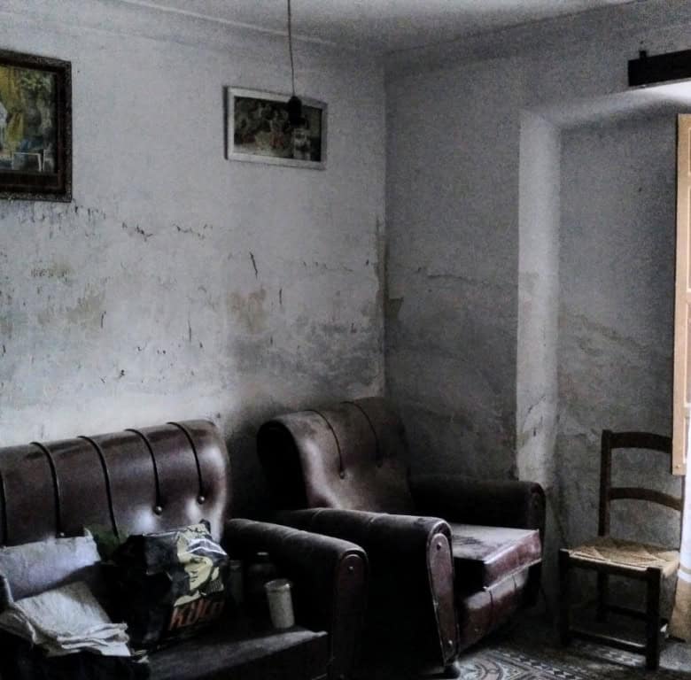 Charming interior of a rural property in La Alqueria, Granada, featuring rustic furniture and tradit.