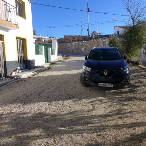 Cave house in Galera, Granada with car parked outside on a sunny day.