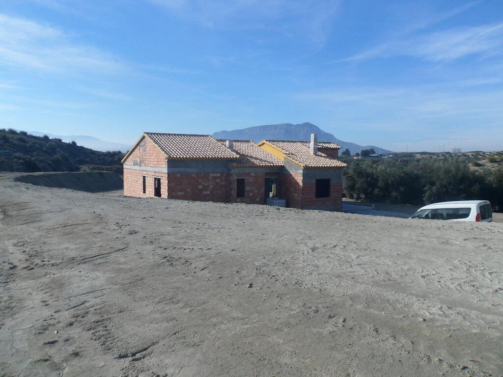 Farm property for sale in Benamaurel, Granada, with scenic mountain views and rural surroundings.