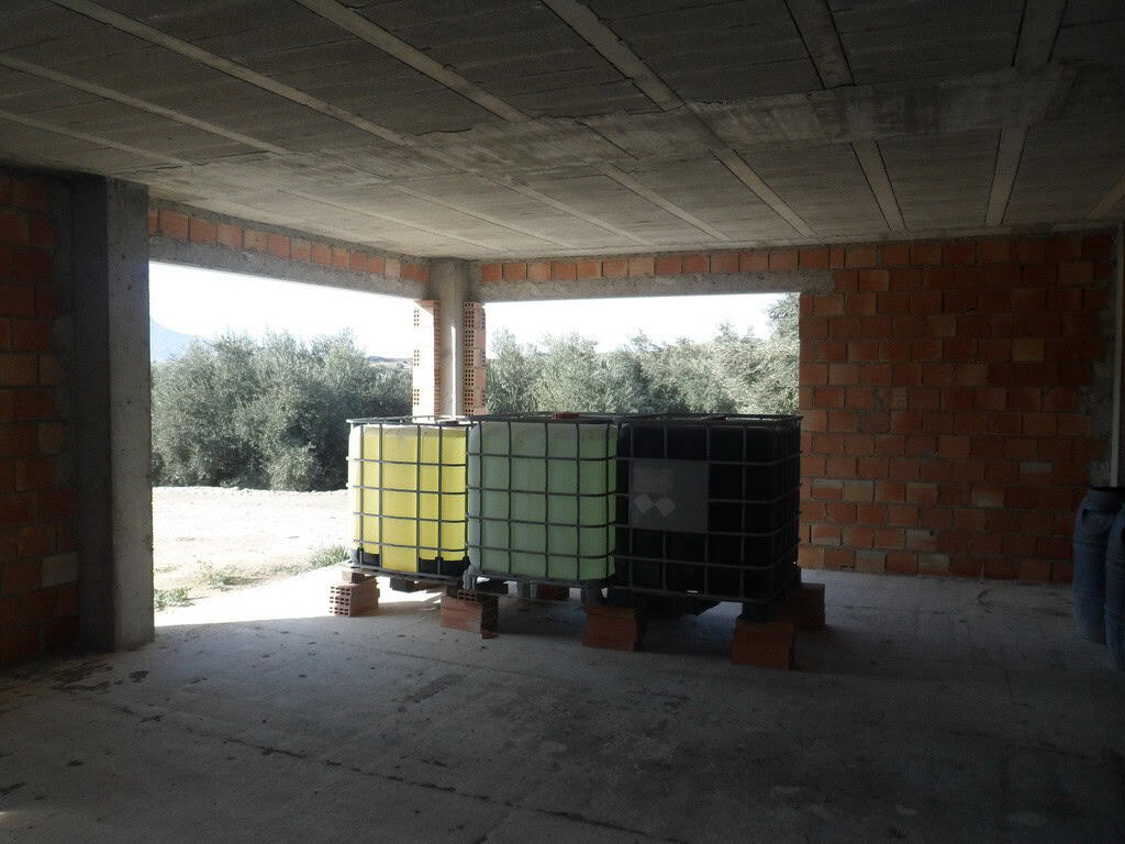 Farm property with water tanks in Benamaurel, Granada, under construction.