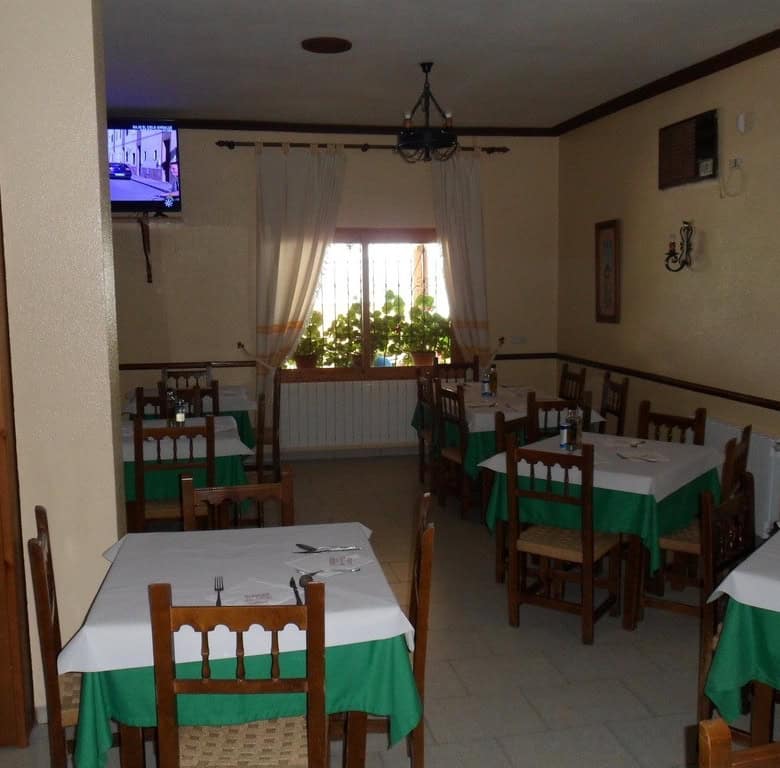 Commercial property interior in Baza, Granada with dining area and traditional decor.